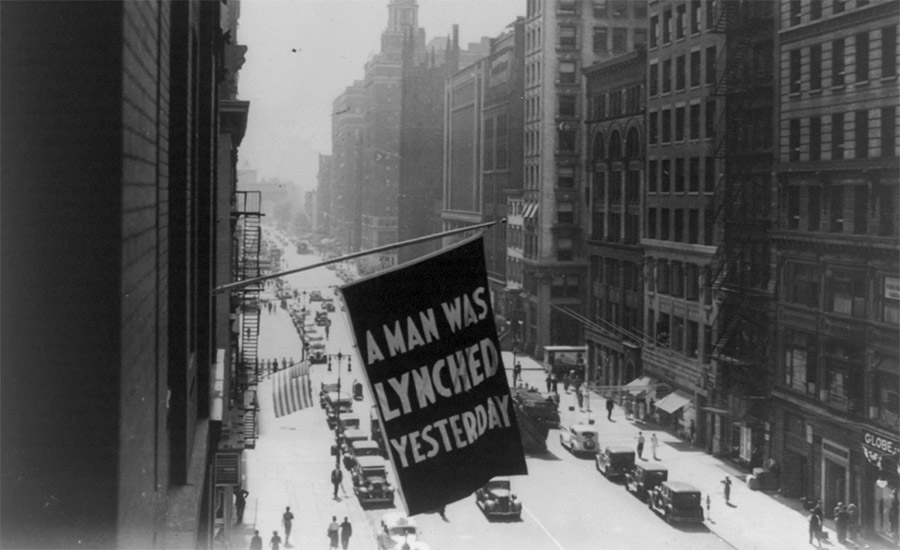 A 1936 photograph shows the NAACP’s flag flying over Fifth Ave.