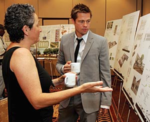 Brad Pitt views Global Green’s sustainable design proposals for New Orleans.
