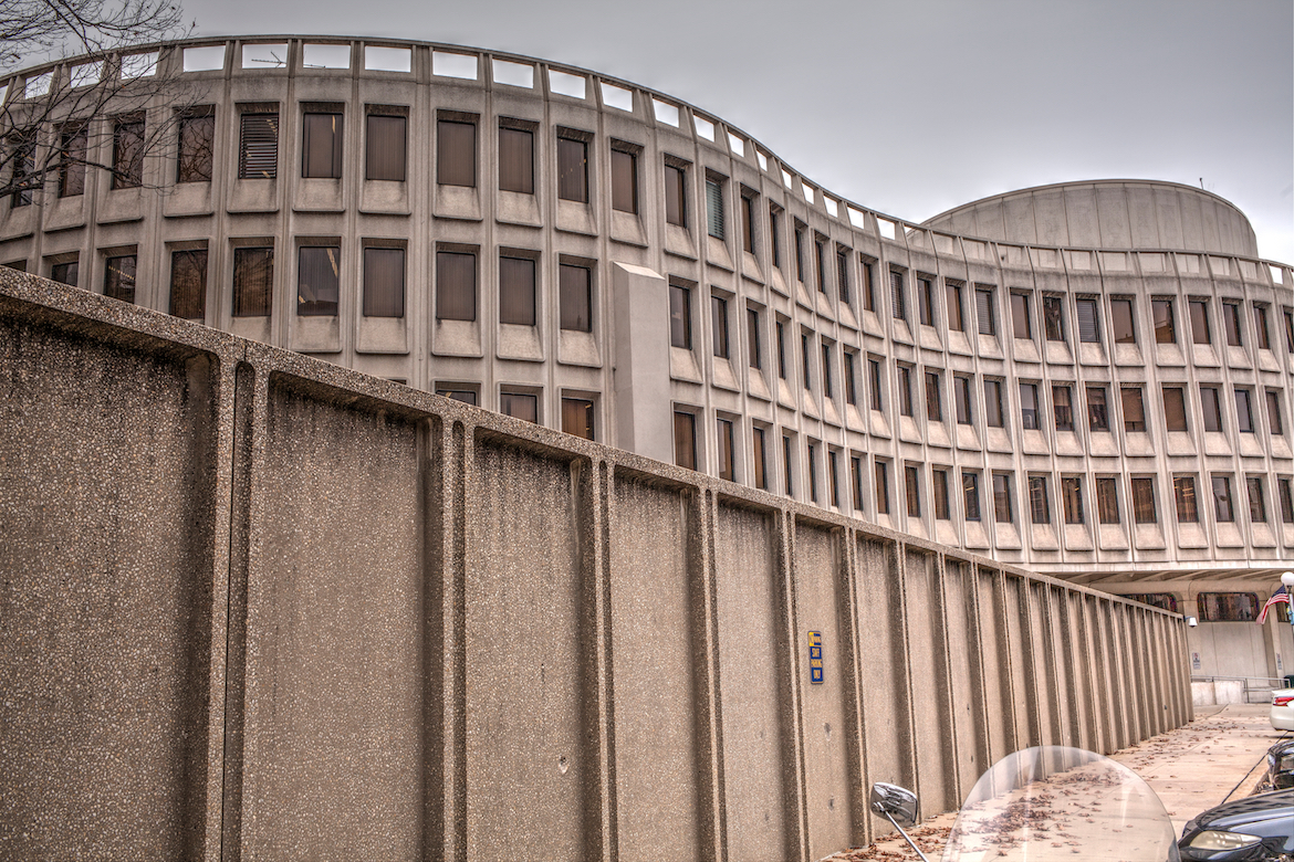 a curving brutalist police building in philadelphia.