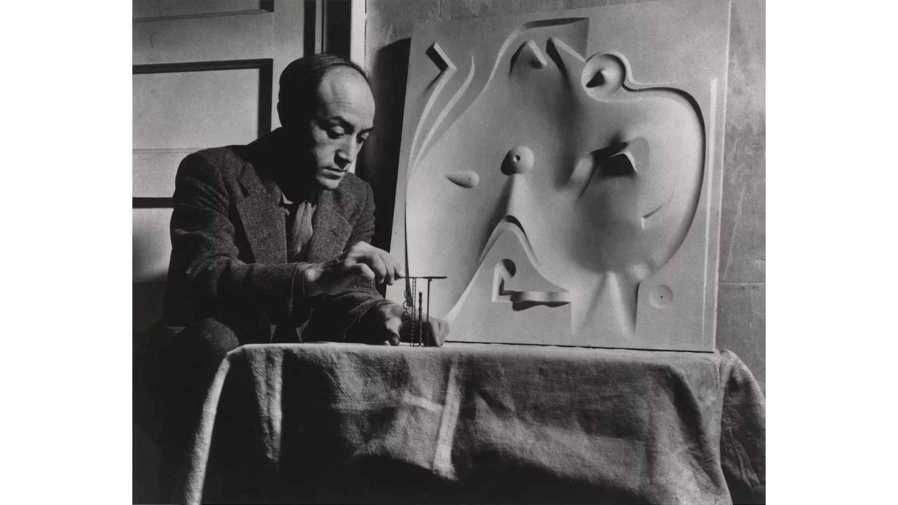 Isamu Noguchi with model for Contoured Playground, c. 1946. The Noguchi Museum Archives, 03775.