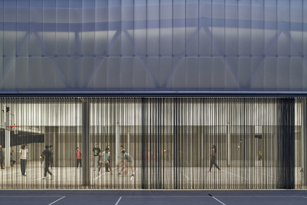 Stainless-steel mesh curtains separate the playing areas.