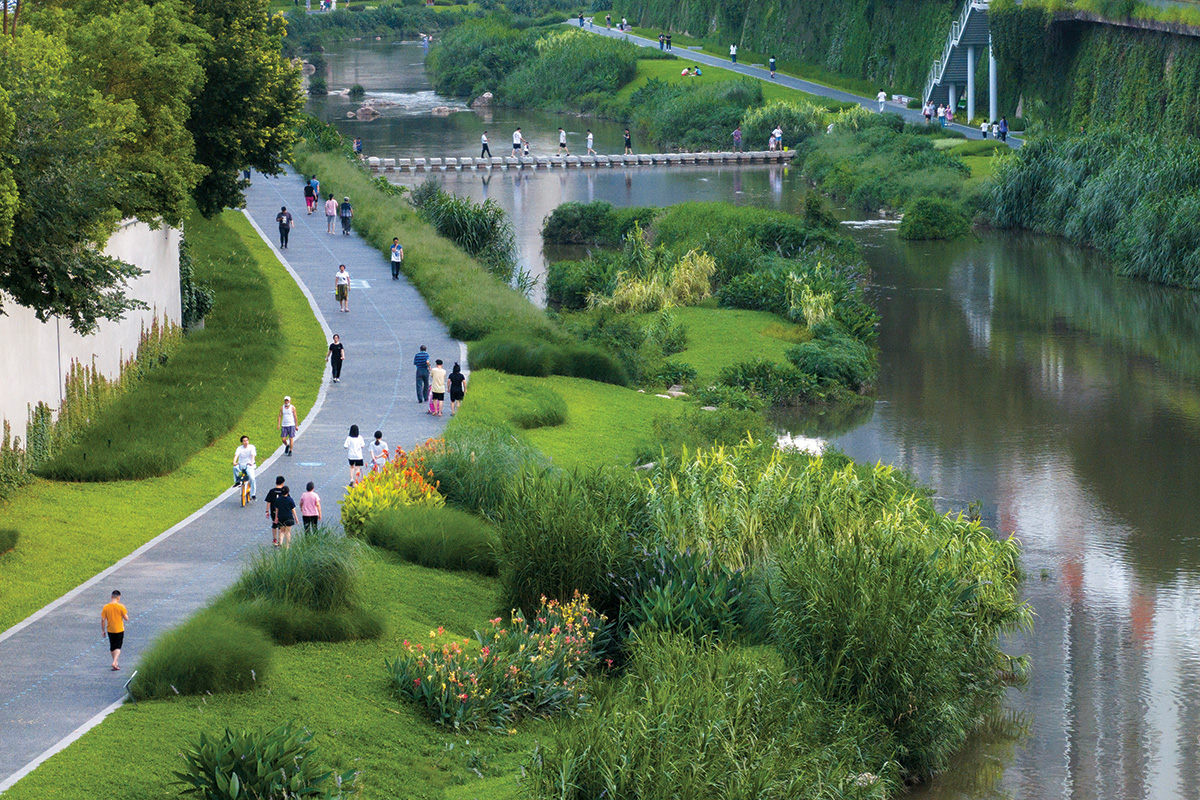 Longgang River Blueway with people in the water.