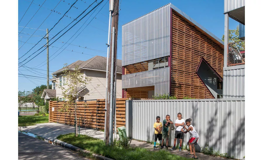 Shotgun Chameleon House steel screen and wooden slats help with ventilation