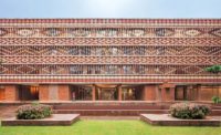 The Krushi Bhawan building's open brick facade uses a pattern inspired by a vernacular textile-dying technique.
