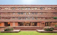 Krushi-Bhawan-01.jpg The Krushi Bhawan building's open brick facade uses a pattern inspired by a vernacular textile-dying technique.