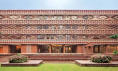 The Krushi Bhawan building's open brick facade uses a pattern inspired by a vernacular textile-dying technique.
