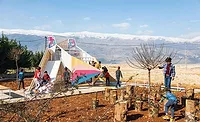The playground in Qaraoun frames views of Mount Lebanon.