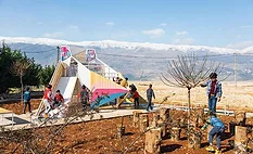 The playground in Qaraoun frames views of Mount Lebanon.