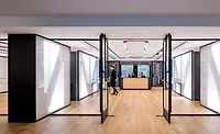 The crisply Miesian reception and exhibition area of NYU&rsquo;s Special Collections Library.
