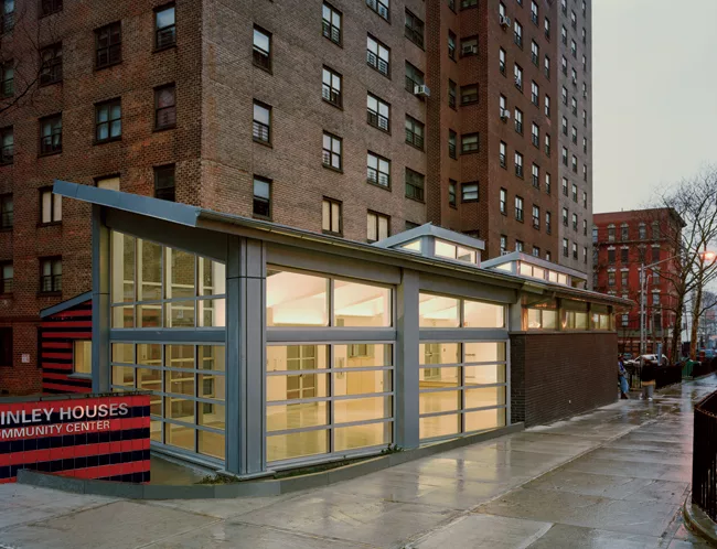 Commissioned by the DDC for a Bronx public housing complex, this community room incorporates generous fenestration to distinguish it from surrounding brick-clad buildings. 