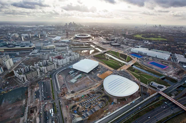Clockwise, from top: The Olympic Stadium, Velodrome, Basketball Arena, Athletes' Village, and Aquatics Centre