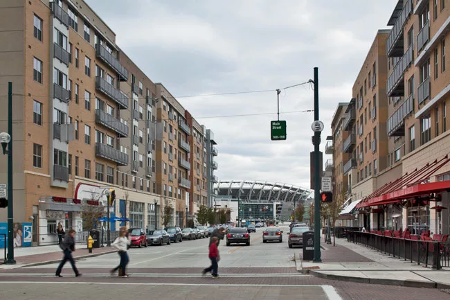 Residential buildings with ground-level retail space and restaurants have started going up between Cincinati's riverfront stadiums. The development, named 'the Banks,' will someday comprise 300 apartm