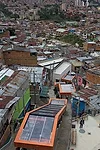 A string of six open-air escalators carries residents 12 stories up the hillside of Medellín's notorious Communa 13 district. Completed in 2012 for about $7 million, it is part of a l