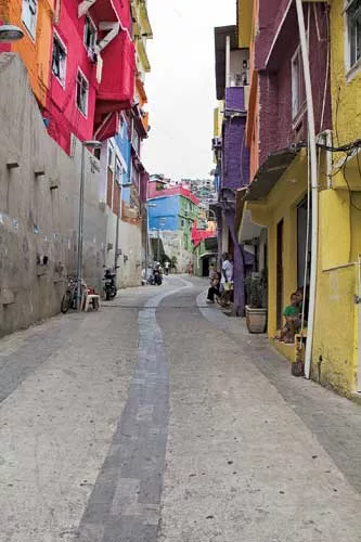 The wide, paved walkway and painted houses in this section of Rio's most populous favela, Rocinha, are the result of the federally funded Growth Acceleration Program, which entered its second phas
