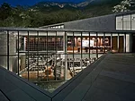 The library, which looks onto one of the courtyards, helps connect the public and private zones and is one of the most dramatic spaces in the house. The complex relationship between indoors and out ha