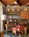 The original owners and their heirs have kept the interior of the lodge intact, including Wright&rsquo;s specially designed furniture, such as the desk in a corner of the living room.