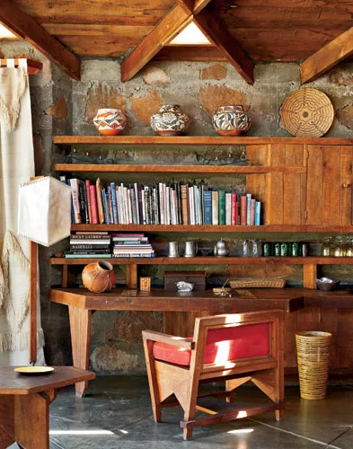 The original owners and their heirs have kept the interior of the lodge intact, including Wright&rsquo;s specially designed furniture, such as the desk in a corner of the living room.