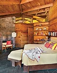Because the morning temperatures can be chilly, even in summer, Wright put fireplaces surrounded by stone walls in each bedroom.