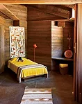 A child&rsquo;s room in the caretaker&rsquo;s cottage lacks a fireplace but still seems cozy due to the extensive wood paneling. Designed by Wright in 1952, this cottage was not realized until 1972, w