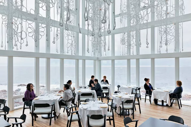 Triple-glazed, argon-filled windows and heavy insulation keep the dining room and other interior spaces comfortable in the 40,000-square-foot inn.