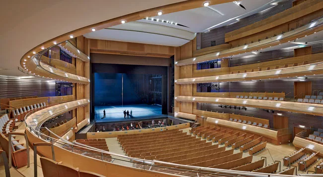The horseshoe-shaped auditorium is wood-lined and provides excellent sightlines and acoustics.