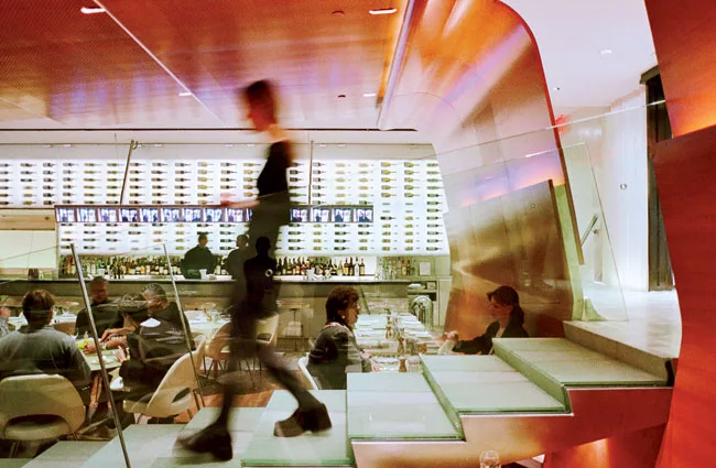 Diller + Scofidio also created some drama in 2000 with its voyeuristic entrance to the Brasserie in New York, where patrons at the bar watch new arrivals descend a flight of stairs on a row of video s