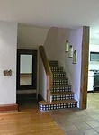 Before photo: stairs prior to renovation of East 12th Street apartment