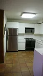 Before photo: Kitchen prior to renovation of East 12th Street apartment