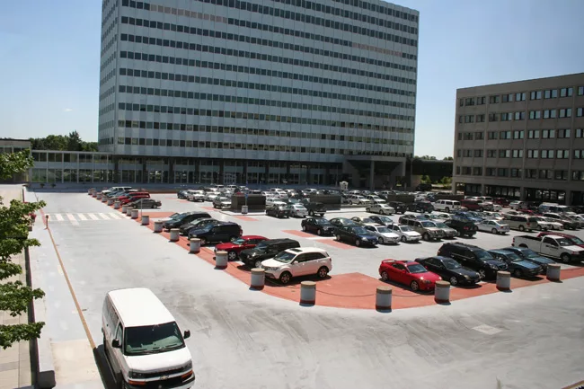 View of visitors parking lot and Building 220 before renovation project.