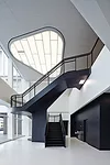 Hitoshi Abe created a two-story space for a new stair leading from the first floor of Building 224 to the lounge area near the new employee entrance.