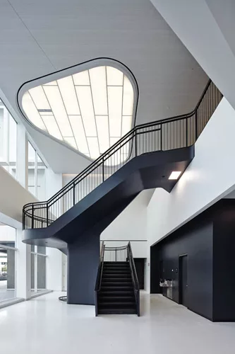 Hitoshi Abe created a two-story space for a new stair leading from the first floor of Building 224 to the lounge area near the new employee entrance.