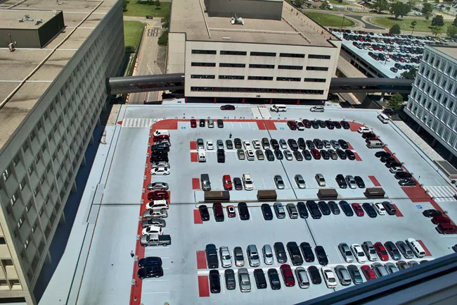 Abe and his team transformed a visitors’ parking lot (left) at the center of the site into a plaza shared by all the surrounding buildings.