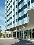 Peter Ebner designed a new canopy for the south side of Building 220 where visitors now pull up (left). He also designed the landscaping in front of the building, as part of the entry sequence.