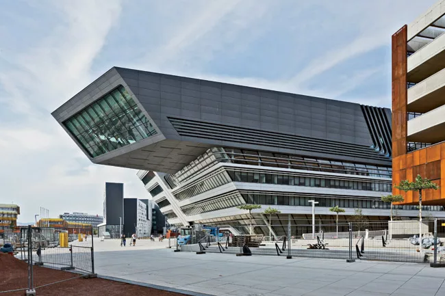 Angled at 35 degrees, Zaha Hadid’s 300,000-square-foot library and Learning Center asserts itself on the central square.
