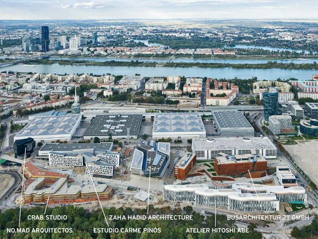 The campus sits between the rectangular buildings of the Messe Exhibition Center and Prater park.
