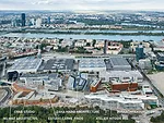 The campus sits between the rectangular buildings of the Messe Exhibition Center and Prater park.
