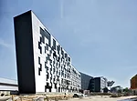 Carme Pin's designed her building as a set of narrow parallelograms connected at a central point. 