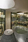 Called Banyan Park, this 23-acre campus includes the company’s headquarters, a conference center, cafeteria, and recreation facilities. TWBTA broke the complex into nine buildings connected by a