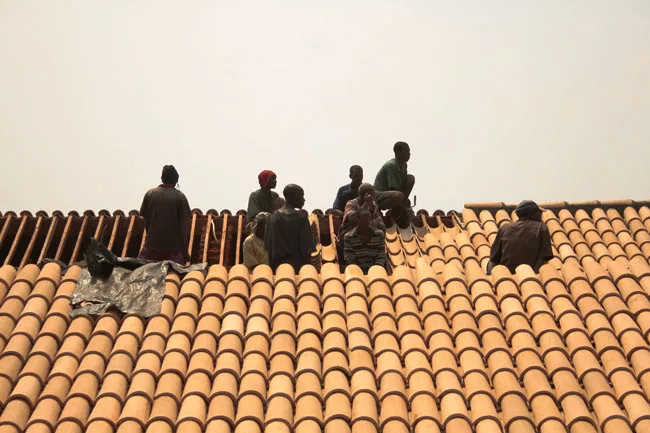 Installing the roof tiles. 