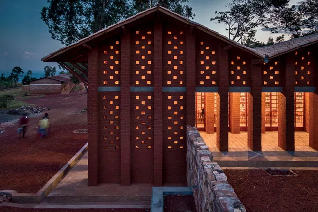 Square spaces between the blocks aid natural ventilation in the library and the porch overlooking a courtyard.