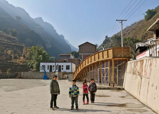 The architects used an existing public plaza and retaining wall as key elements in their design.