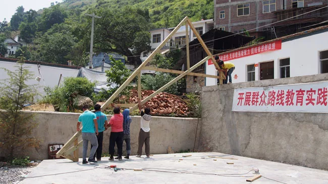 The first truss goes up.  