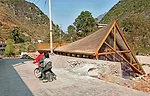 The peaked roof echoes the form of nearby mountains.