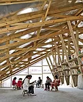 Standard wood benches and stools, found in most rural Chinese schools, serve as the only furniture. Translucent poly'carbonate panels bring daylight into the interior.