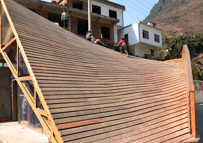 Climbing up the roof. 