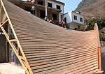 Climbing up the roof. 