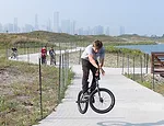 A mile-long path winds around the park for bikers, bird watchers, and other explorers to experience the island's serene stretches of lakefront.