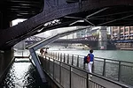 Designed and built by Sasaki Associates, Ross Barney Architects, and Alfred Benesch engineers, the Riverwalk will stretch 1-1/4 miles to Lake Michigan upon completion.