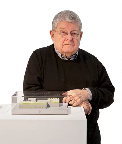 Stanley Tigerman shows his model for the Pacific Garden Mission, Chicago's oldest rescue center for the homeless, in 2006, a year before it opened.