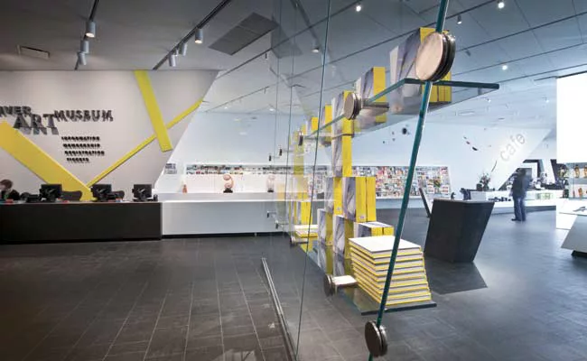 Visitors enter the museum shop through the lobby. There are no doors because the shop is only open when the museum is open.